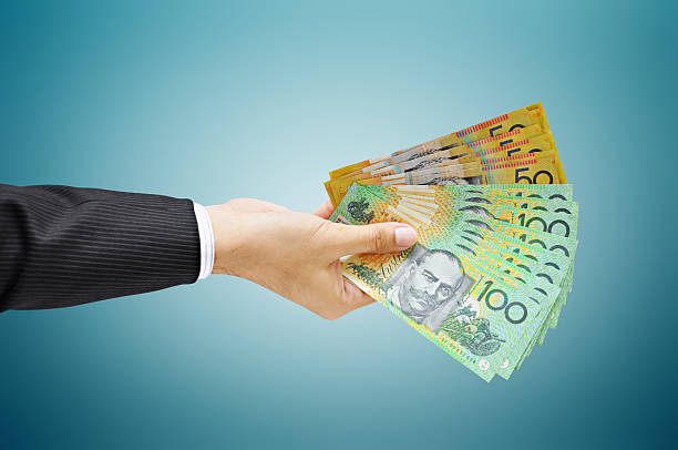 Hand holding Australian money